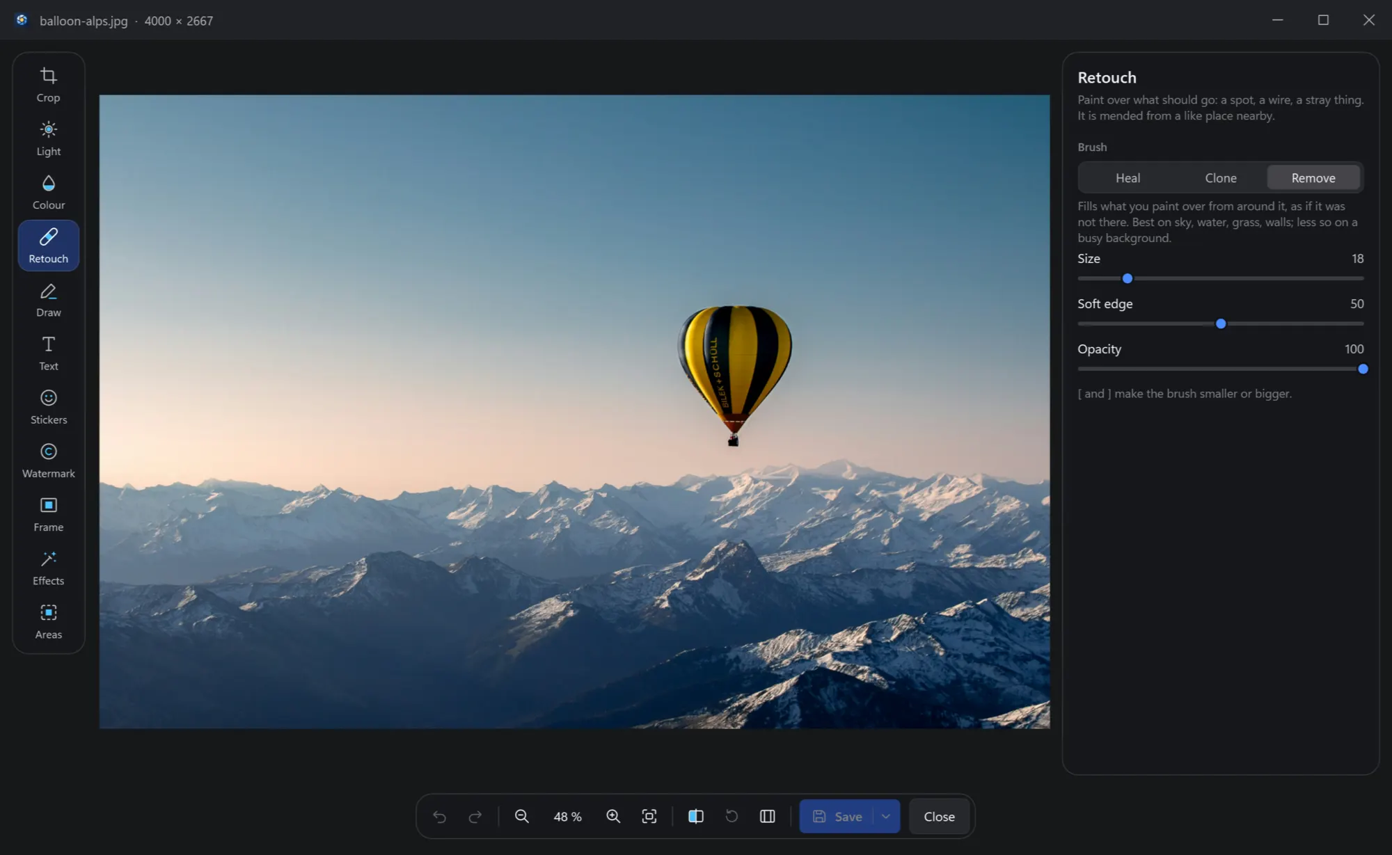 The editor with a balloon over the Alps